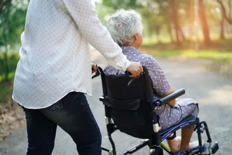 Caregiver assisting a long-term care resident