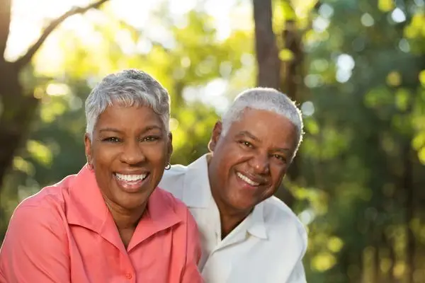 Smiling retired couple outdoors