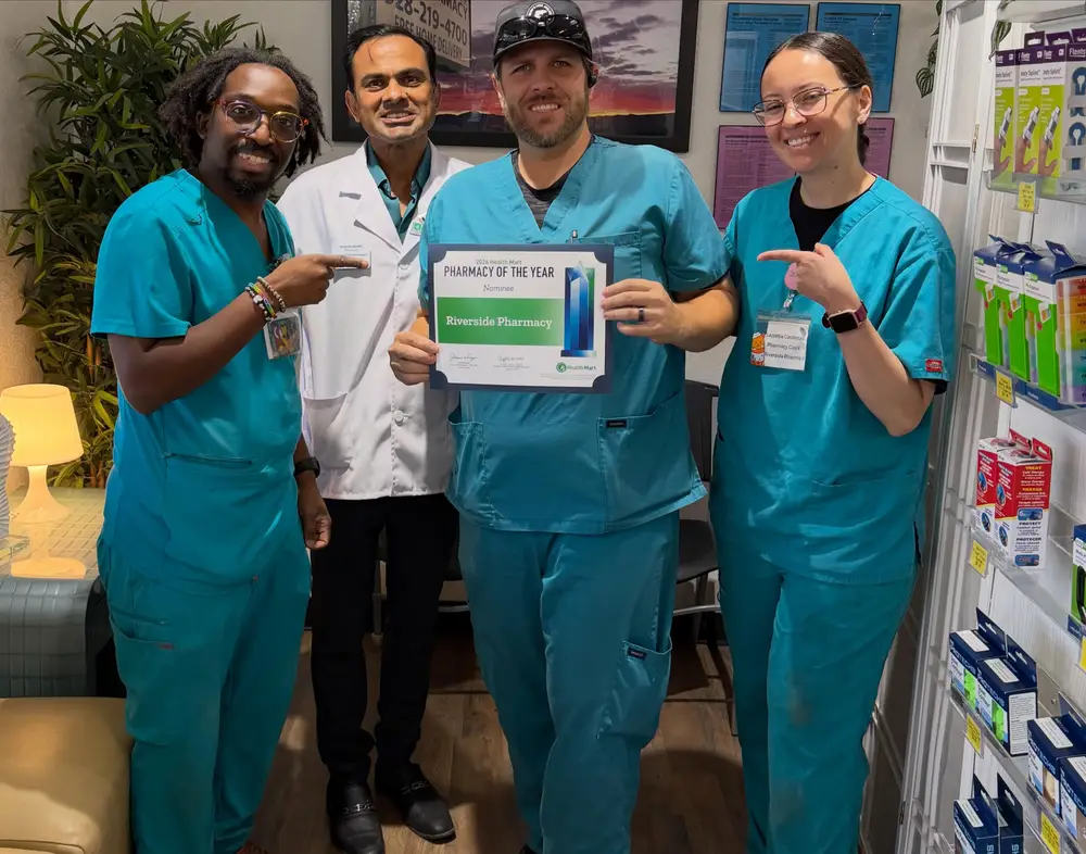 The Riverside Pharmacy team holding their Pharmacy of the Year nominee certificate