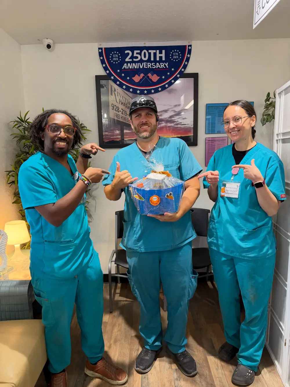 The Riverside Pharmacy team in teal scrubs